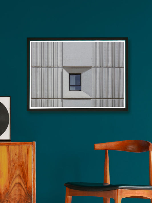 Cecil Street Building Photography on a wall with a chair and side unit