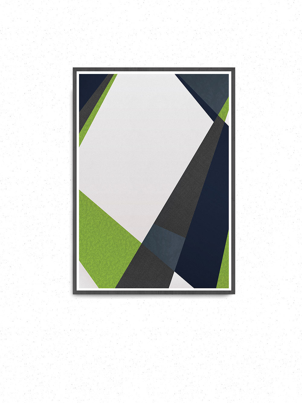 Green and Blue Geometric Print in a frame on a wall