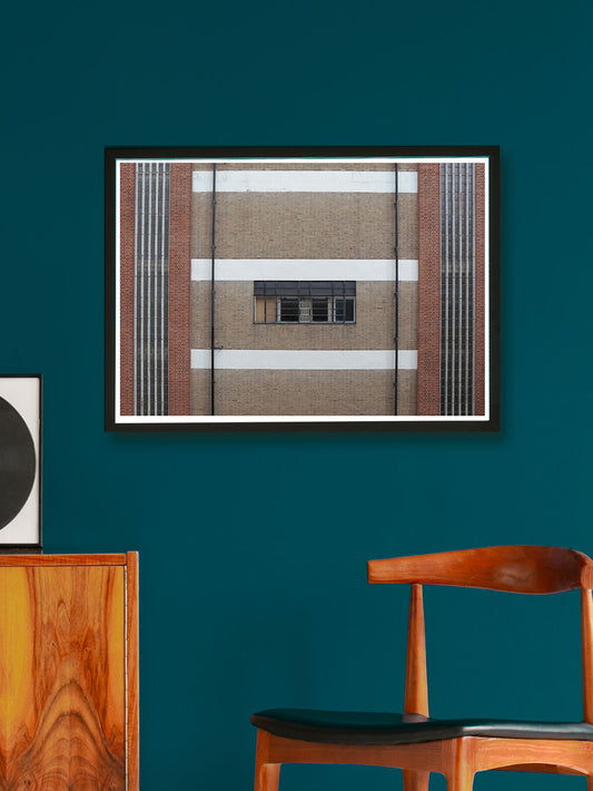 Fraser Window Building Photo Print in a frame on a blue wall