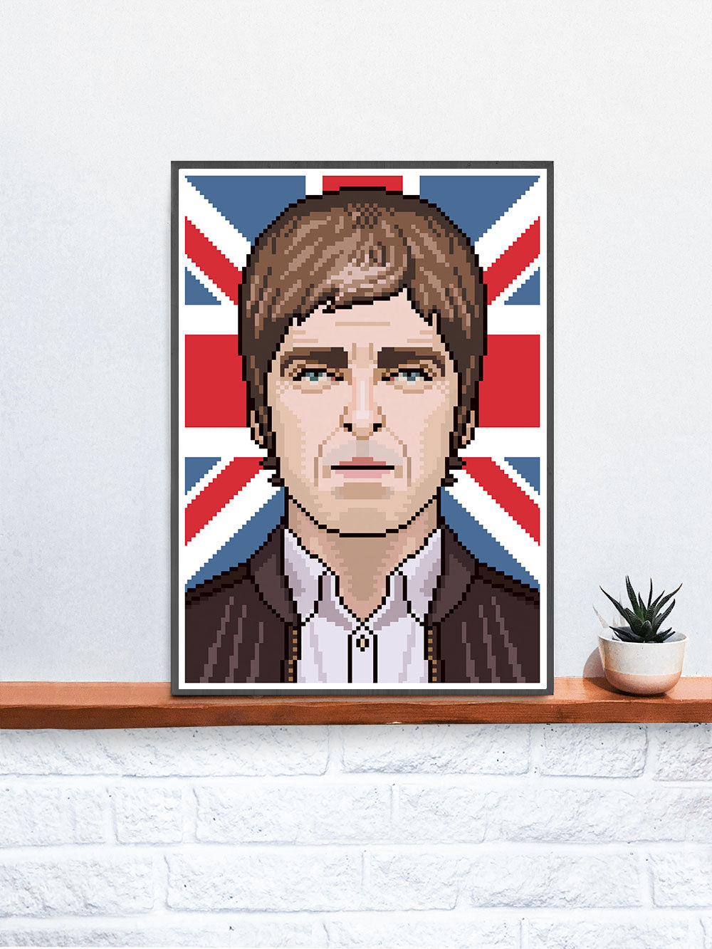 Noel Brit Pop Art Print in a frame on a shelf