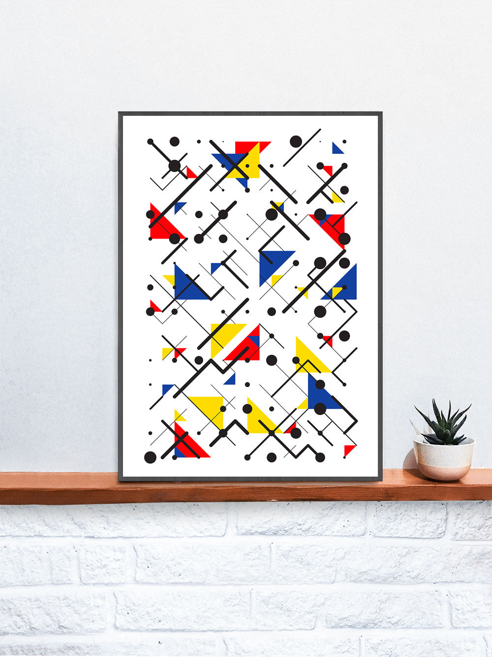 Primary 1 Line and Shape Art Print in a frame on a shelf