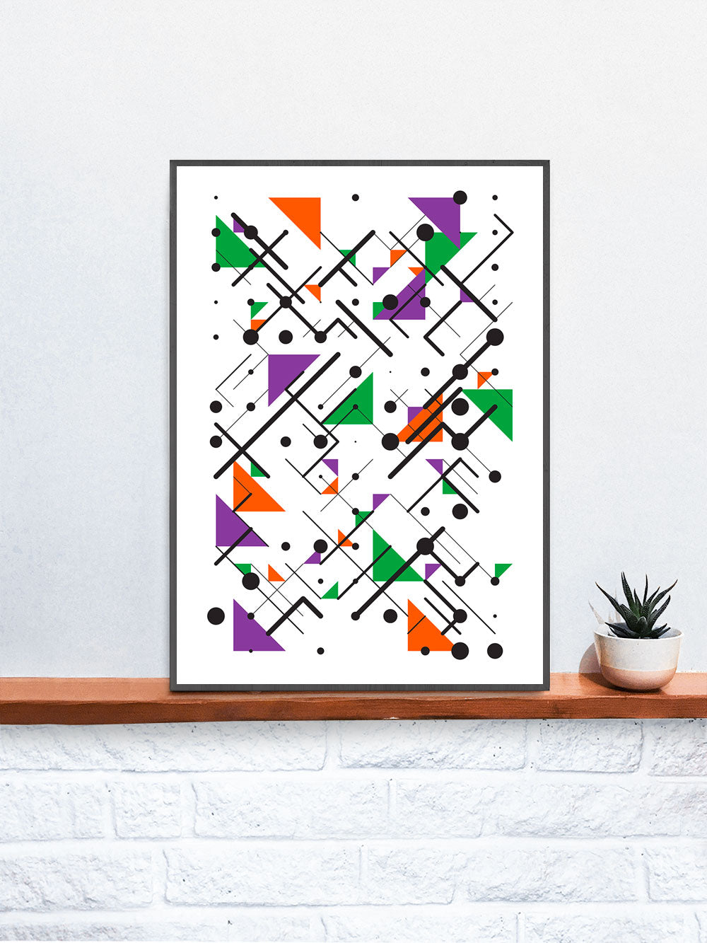 Secondary 1 Line and Triangle Print in a frame on a shelf