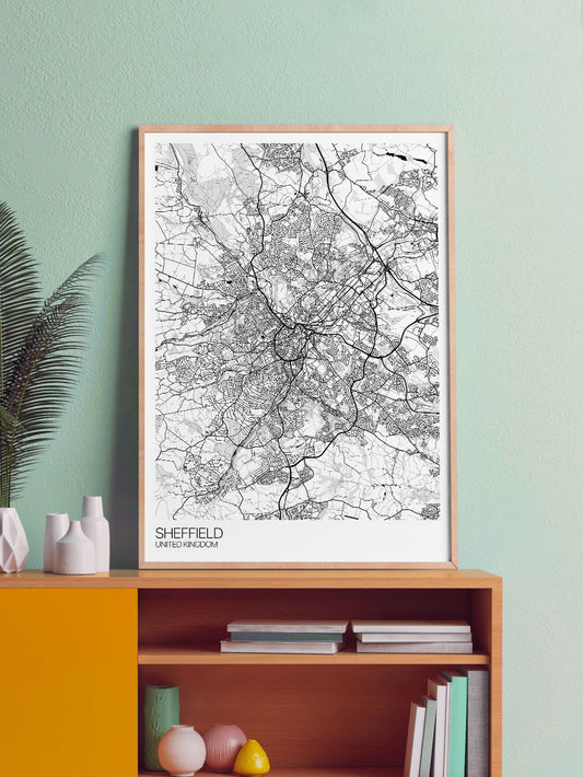 Sheffield City Art Design Print in a frame on a shelf