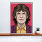 Mick Rock Icon Art Print in a frame on a shelf