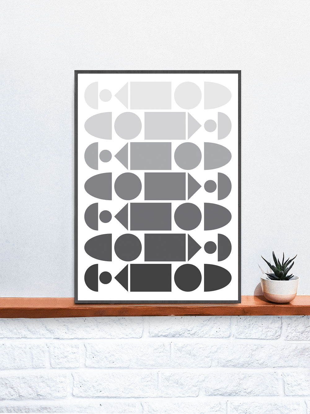 Monochrome Progression Black and White Pattern Design in a frame on a shelf