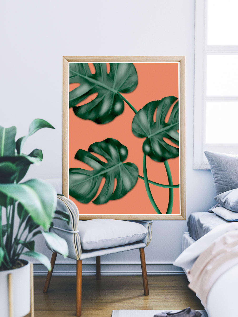 Monstera Orange Botanical Illustration Print sitting on a chair in a bedroom