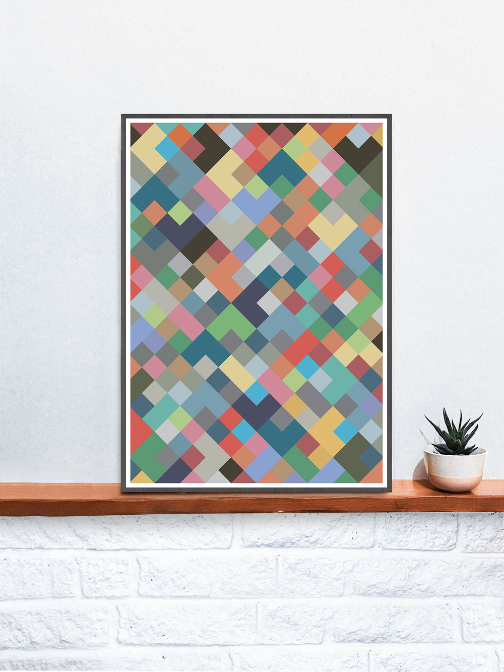 Mosaic 2 Geometric Mosaic Print in a frame on a shelf