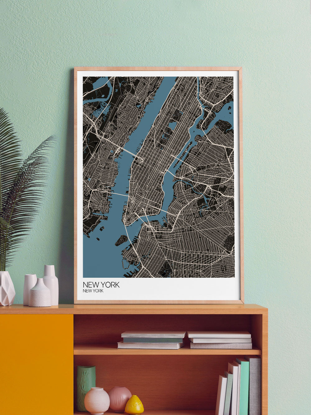 New York Graphic Map Design Print in a frame on a shelf