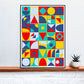 Pop Tones Shapes Abstract Art Print in a frame on a shelf