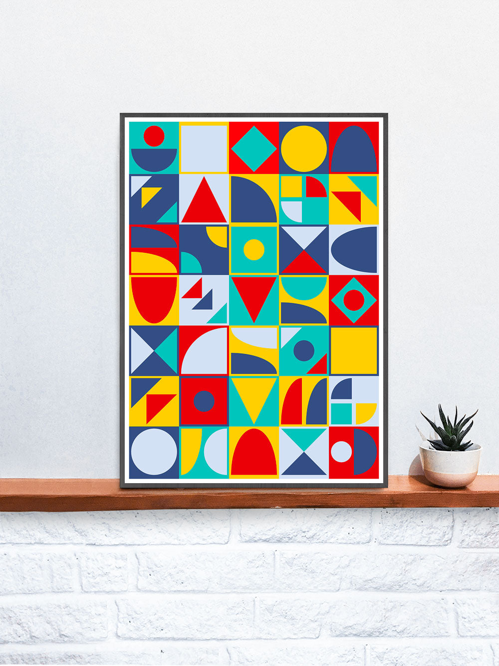 Pop Tones Shapes Abstract Art Print in a frame on a shelf