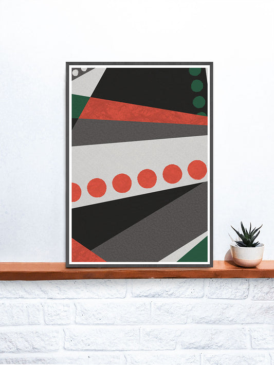 Red and Green Geometric Modern Wall Art in a frame on a shelf